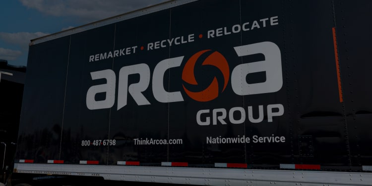 Side of an ARCOA truck with the ARCOA Group logo